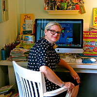 Liza Charlesworth at her desk